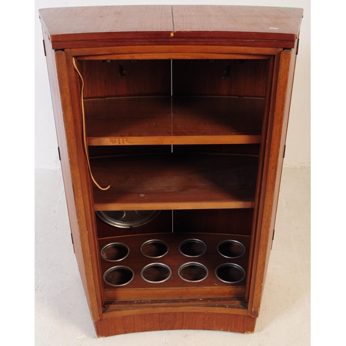 679 - British Modern Design - A mid 20th century teak drinks / cocktail cabinet. Twin front doors with fla... 