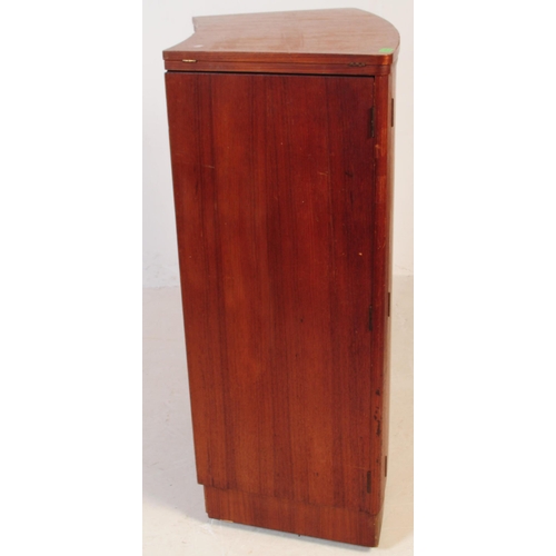 679 - British Modern Design - A mid 20th century teak drinks / cocktail cabinet. Twin front doors with fla... 