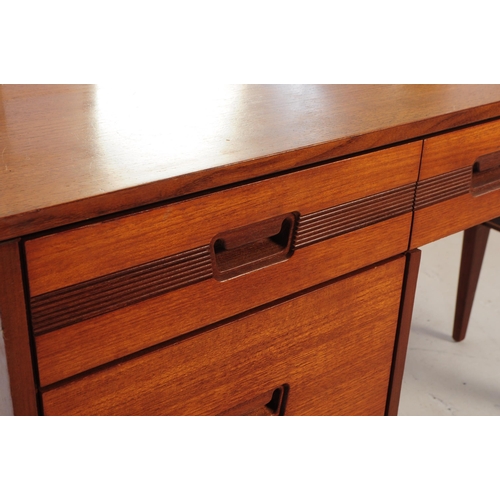 683 - British Modern Design - Mid 20th century teak dressing table. Rectangular form with knee hole to cen... 