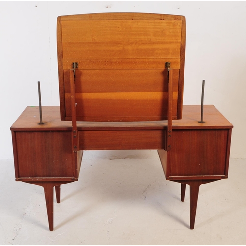 683 - British Modern Design - Mid 20th century teak dressing table. Rectangular form with knee hole to cen... 