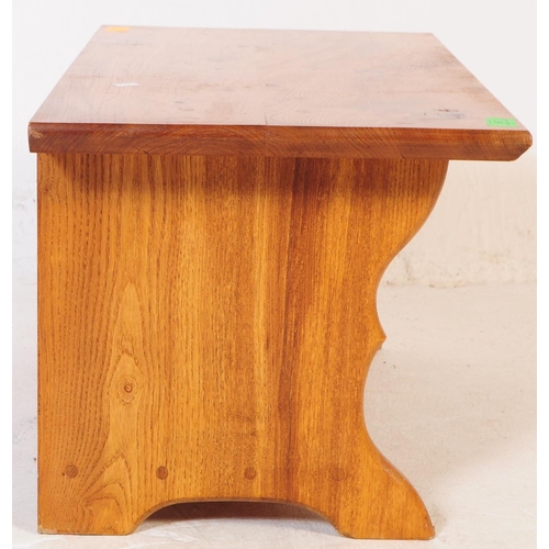 697 - A vintage later 20th century pine wood coffee / side / occasional table. Having rectangular top over... 