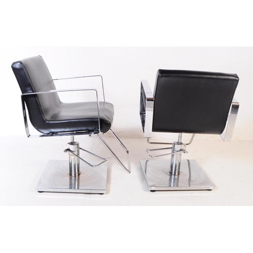 702 - Four contemporary salon barber chairs / adjustable armchairs. The chairs upholstered in black vinyl ... 