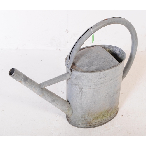 705 - A collection of mid 20th century galvanised bath/planters & watering cans. To include three oval gal... 