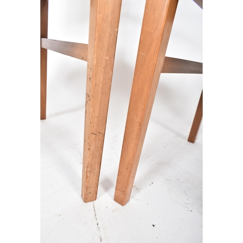 720 - Gordon Russell of Broadway - A pair of mid century oak framed carver armchairs. Each elbow chair hav... 