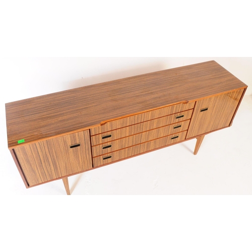 722 - Beautility - A mid 20th century Beautility veneer sideboard. The sideboard featuring a central bank ... 