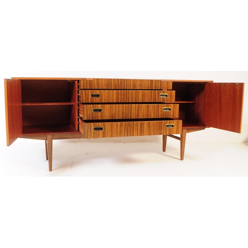 722 - Beautility - A mid 20th century Beautility veneer sideboard. The sideboard featuring a central bank ... 