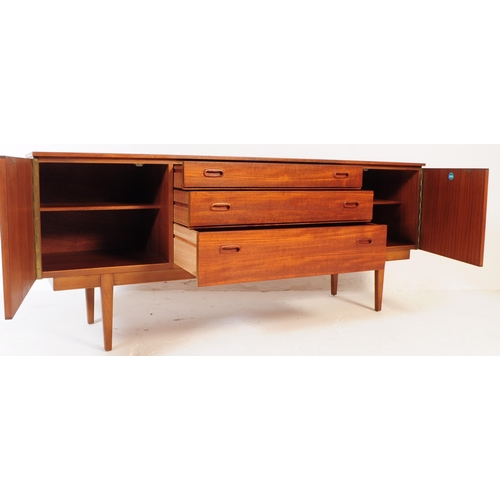 724 - Nathan Furniture - A mid 20th century Nathan Furniture teak wood sideboard credenza. The sideboard h... 