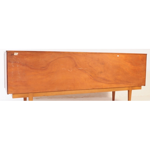 724 - Nathan Furniture - A mid 20th century Nathan Furniture teak wood sideboard credenza. The sideboard h... 