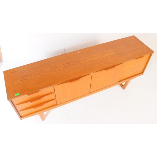 725 - Stonehill - A mid 20th century Stonehill teak wood sideboard credenza. The sideboard having two cupb... 