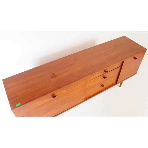 726 - Avalon - A mid 20th century Avalon teak wood sideboard credenza. The sideboard having a long drop do... 