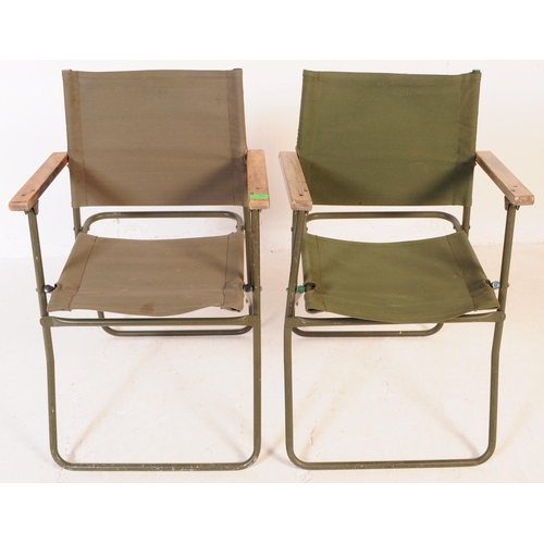 728 - A pair of mid 20th century metal and canvas folding military chairs. The chairs having bent painted ... 