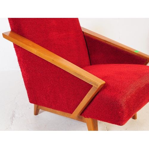 735 - A pair of mid 20th century circa 1950s oak framed lounge armchairs. The chairs having red boucle fab... 