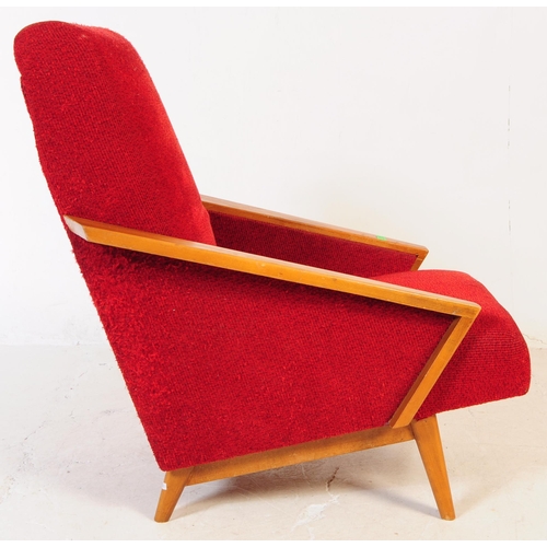 735 - A pair of mid 20th century circa 1950s oak framed lounge armchairs. The chairs having red boucle fab... 