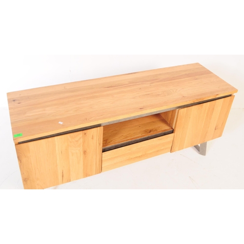 742 - Oak Furniture Land - A contemporary oak media cabinet / sideboard. Of rectangular for with central s... 