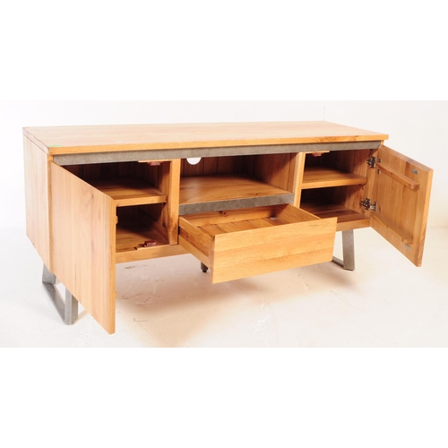 742 - Oak Furniture Land - A contemporary oak media cabinet / sideboard. Of rectangular for with central s... 