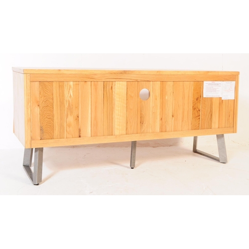 742 - Oak Furniture Land - A contemporary oak media cabinet / sideboard. Of rectangular for with central s... 