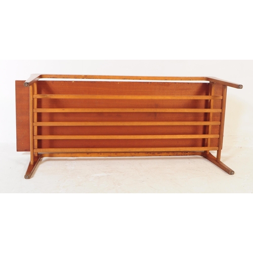 743 - British Modern Design - Vintage mid 20th century teak coffee table. Rectangular form with plank top,... 