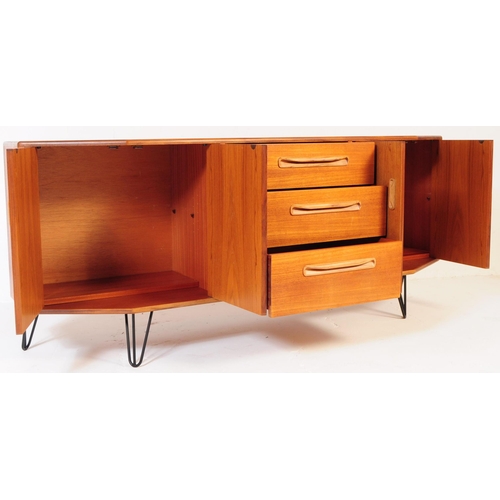 745 - G Plan Furniture - A British retro mid 20th century teak sideboard. Of rectangular form with a bank ... 