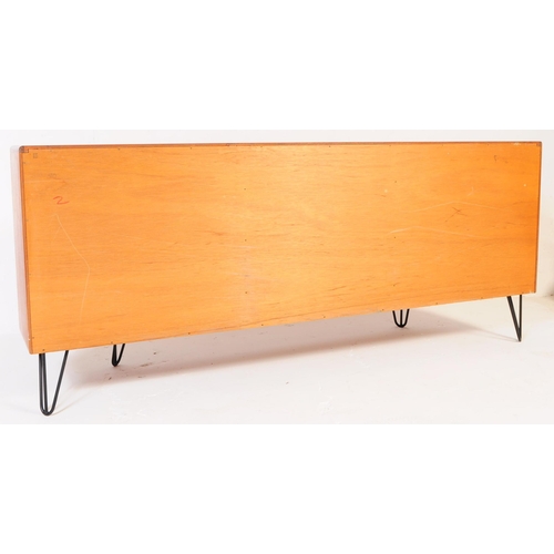 745 - G Plan Furniture - A British retro mid 20th century teak sideboard. Of rectangular form with a bank ... 