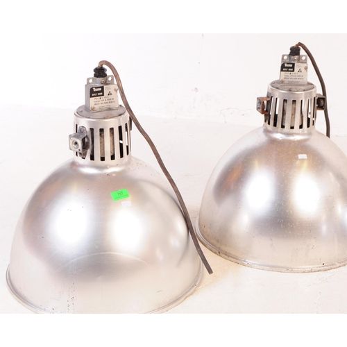 757 - A set of four industrial chrome metal factory hanging ceiling lights. Having a conical tapering shad... 