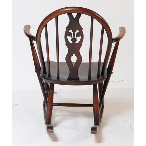 758 - Lucian Ercolani - Ercol - A 1970s vintage beech and elm rocker / rocking chair having a spindle back... 