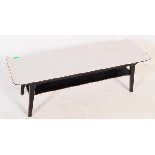 759 - A mid 20th century 1960s ebonised Myer coffee table. Of rectangular form with formica sleigh top cor... 