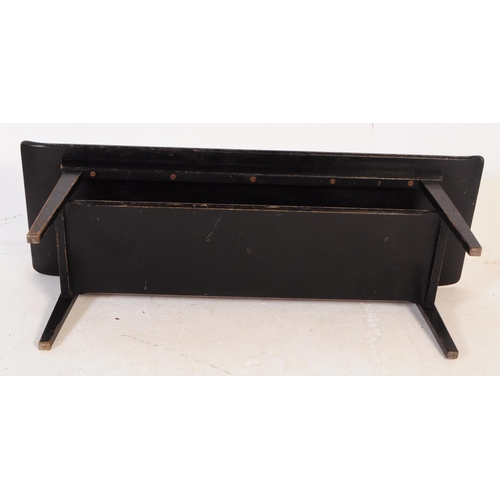 759 - A mid 20th century 1960s ebonised Myer coffee table. Of rectangular form with formica sleigh top cor... 