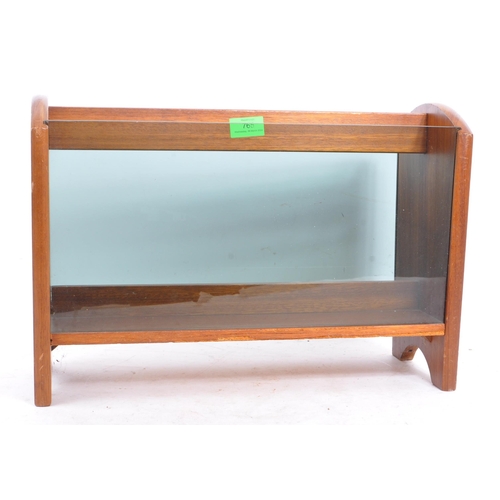 765 - A retro 1970s century teak wood & smoked glass magazine rack. Rectangular form with smoked glass ins... 