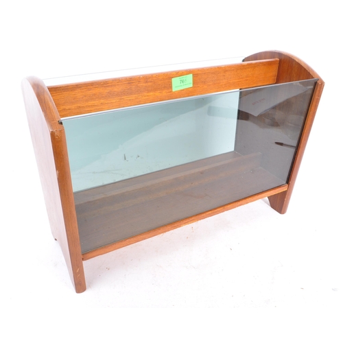 765 - A retro 1970s century teak wood & smoked glass magazine rack. Rectangular form with smoked glass ins... 