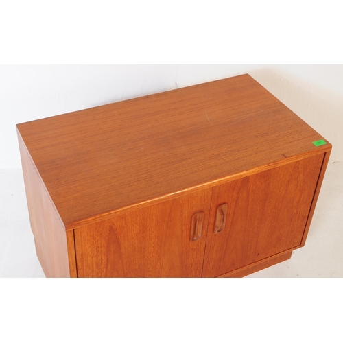 766 - G-Plan - A retro 1970's teak wood cupboard cabinet. Having twin cupboard doors, with shelved interio... 