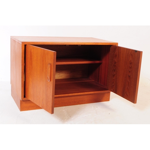 766 - G-Plan - A retro 1970's teak wood cupboard cabinet. Having twin cupboard doors, with shelved interio... 