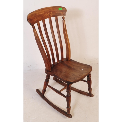 770 - A 19th century Victorian beech and elm Windsor nursing rocking chair. Having a curved top with flat ... 