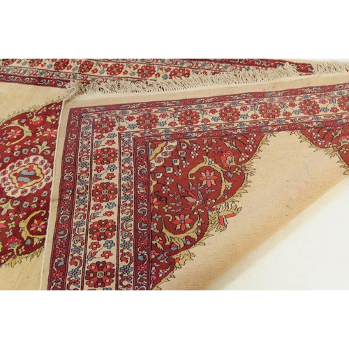 773 - A 20th century central Persian Sarouk manner carpet floor rug. The rug having a cream ground with la... 