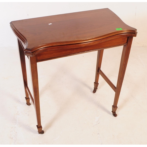 779 - Edwardian early 20th century mahogany fold over games card table. The table being raised on tapering... 