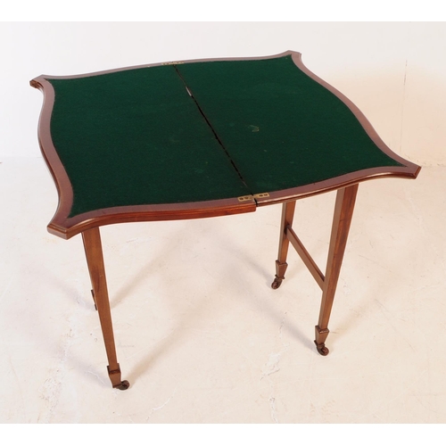 779 - Edwardian early 20th century mahogany fold over games card table. The table being raised on tapering... 