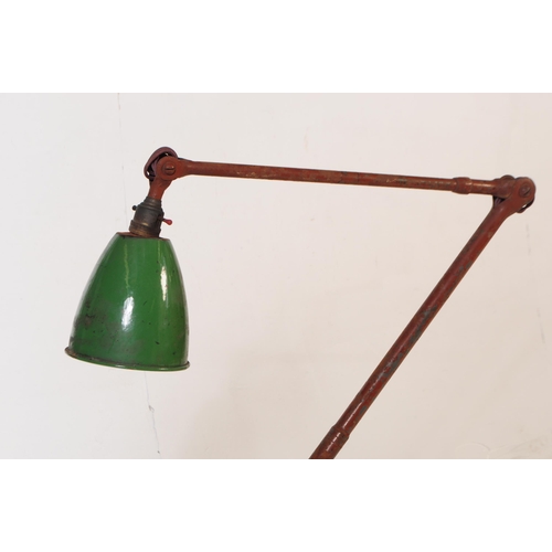 789 - A vintage mid 20th century industrial factory work lamp light. Having a green enamelled conical shad... 