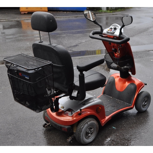 792 - Kymco - Foru - An orange contemporary mobility scooter. Having an orange and silver colourway with f... 