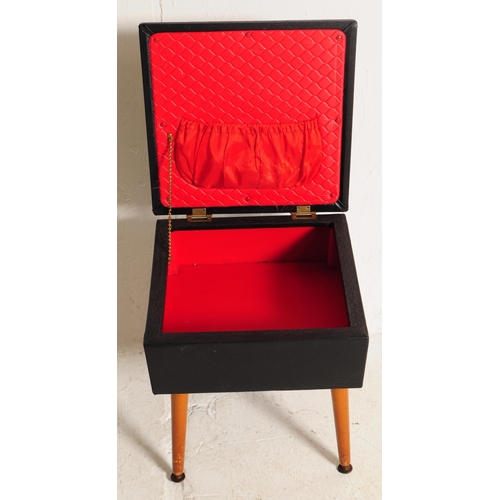 688 - Sherbourne - A retro mid 20th century circa 1960s black vinyl sewing box. The sewing box having cush... 