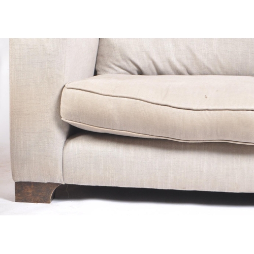 694 - Rossiters of Bath - a Contemporary Modern British Design two seater sofa settee. Having wingback bac... 