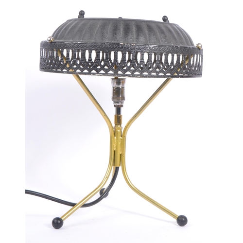 748 - A late 20th century brass tripod table lamp with pressed tin lampshade with pierced decoration shade... 