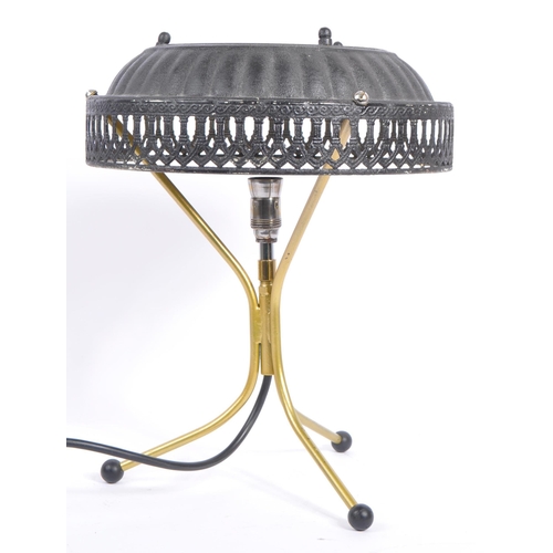 748 - A late 20th century brass tripod table lamp with pressed tin lampshade with pierced decoration shade... 