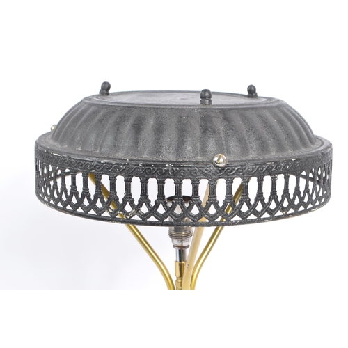 748 - A late 20th century brass tripod table lamp with pressed tin lampshade with pierced decoration shade... 