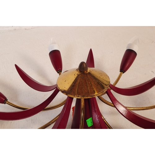 671 - A mid 20th century sputnik manner spider ceiling light / lamp. The light featuring seven arms extend... 