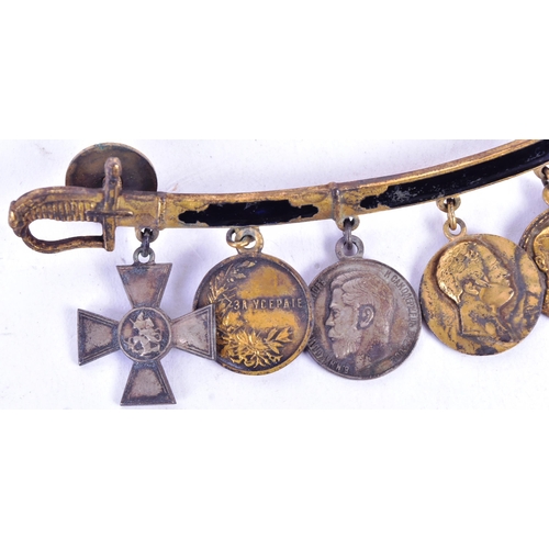 106 - A collection of Imperial Russian miniature medals mounted onto a cavalry sabre shaped suspension. Me... 