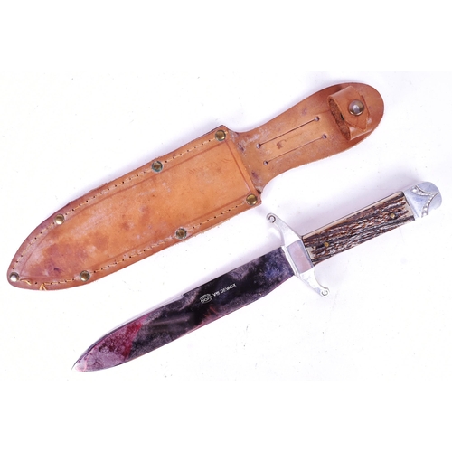 139 - A collection of assorted Militaria comprising a saw back blade survival knife with ball compass pomm... 