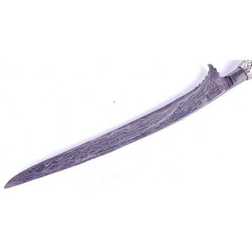 161 - An Indonesian / Sumatra (Aceh) Rencong dagger. Silvered hooked grip incised with scrolling motifs an... 