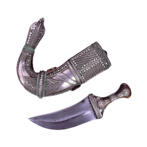 17 - A 19th Century Kenyan / (Taiz) Jambiya / Khanjar dagger. Horn grip with applied white metal filigree... 