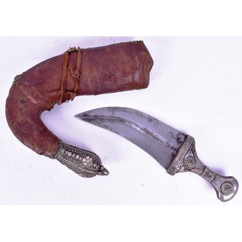 17 - A 19th Century Kenyan / (Taiz) Jambiya / Khanjar dagger. Horn grip with applied white metal filigree... 