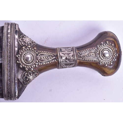 17 - A 19th Century Kenyan / (Taiz) Jambiya / Khanjar dagger. Horn grip with applied white metal filigree... 