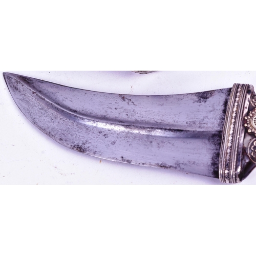 17 - A 19th Century Kenyan / (Taiz) Jambiya / Khanjar dagger. Horn grip with applied white metal filigree... 